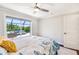 Bedroom with an open sliding door to the outdoor patio with furniture at 10233 St Paul Dr, Port Charlotte, FL 33981