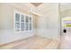 Bright dining room features ample natural light and beautiful wood floors at 10233 St Paul Dr, Port Charlotte, FL 33981