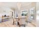 Bright dining room with modern chandelier and views of the outdoor pool at 10233 St Paul Dr, Port Charlotte, FL 33981