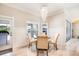 Cozy dining area with chandelier and view to the pool at 10233 St Paul Dr, Port Charlotte, FL 33981