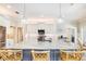 Modern kitchen with large island, pendant lighting and stainless steel refrigerator at 10233 St Paul Dr, Port Charlotte, FL 33981