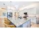 Spacious kitchen with island, stainless steel appliances and breakfast bar at 10233 St Paul Dr, Port Charlotte, FL 33981