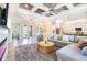 Bright living room with comfortable sectional, backyard view, and open floor plan at 10233 St Paul Dr, Port Charlotte, FL 33981