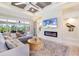 Cozy living room with fireplace, TV and comfortable sectional sofa at 10233 St Paul Dr, Port Charlotte, FL 33981