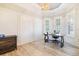 Spacious office with wood floors, detailed wall trim and plantation shutters at 10233 St Paul Dr, Port Charlotte, FL 33981