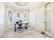 Bright office with stylish desk, modern lighting and three windows at 10233 St Paul Dr, Port Charlotte, FL 33981