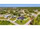 The aerial shows the home, adjacent lot and the surrounding neighborhood at 1321 Calgary Rd, North Port, FL 34288