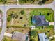 Aerial view showcasing a home's large, fenced backyard, in ground pool, and overall lot layout at 1321 Calgary Rd, North Port, FL 34288