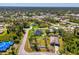 This is an aerial view of the property including the adjacent lot and neighborhood at 1321 Calgary Rd, North Port, FL 34288
