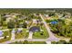 An aerial view shows home, additional lot for sale and neighborhood at 1321 Calgary Rd, North Port, FL 34288