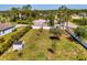 A spacious grassy backyard features a shed and a white privacy fence at 1321 Calgary Rd, North Port, FL 34288