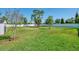 Large grassy backyard featuring a shed and ample open space at 1321 Calgary Rd, North Port, FL 34288