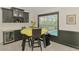 Cozy breakfast nook with a view of the pool and modern cabinetry at 1321 Calgary Rd, North Port, FL 34288
