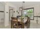Dining room with modern lighting and stylish decor, adjacent to front entry at 1321 Calgary Rd, North Port, FL 34288