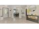 Bright and spacious foyer with tiled floors and open layout, seamlessly connecting to the dining area, enhancing the home's flow at 1321 Calgary Rd, North Port, FL 34288