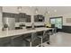 Modern kitchen boasting black cabinets, stainless steel appliances, and white countertops at 1321 Calgary Rd, North Port, FL 34288