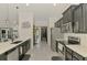 Modern kitchen featuring stainless steel appliances and dark cabinetry at 1321 Calgary Rd, North Port, FL 34288