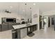 Open kitchen with dark cabinets, stainless appliances, and a center island at 1321 Calgary Rd, North Port, FL 34288