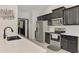 Modern kitchen featuring stainless steel appliances, black cabinets and white countertops at 1321 Calgary Rd, North Port, FL 34288