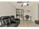 Inviting room with cozy recliners, desk, and view into other rooms through sliding glass doors at 1321 Calgary Rd, North Port, FL 34288
