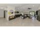 Open-concept living area with tile flooring, connecting the kitchen, dining, and living spaces, perfect for modern living and entertaining at 1321 Calgary Rd, North Port, FL 34288