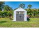 New backyard storage shed with double doors and charming design at 1321 Calgary Rd, North Port, FL 34288