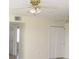Bright bedroom with neutral walls, tile flooring, ceiling fans, and a closet at 139 Dow Rd, Port Charlotte, FL 33952