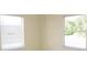Small room with neutral walls, white blinds, and two large windows at 139 Dow Rd, Port Charlotte, FL 33952