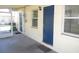 Home's entryway shows a bright blue front door under a covered porch at 139 Dow Rd, Port Charlotte, FL 33952