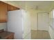 Kitchen space featuring a refrigerator, cabinets, tiled floor, and a ceiling fan at 139 Dow Rd, Port Charlotte, FL 33952