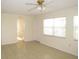 Spacious living room with tile floors, light walls, and lots of natural light at 139 Dow Rd, Port Charlotte, FL 33952