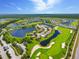 Stunning aerial view of the community, golf course, and surrounding lakes at 14271 Heritage Landing Blvd # 1516, Punta Gorda, FL 33955