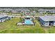 A community pool featuring clear blue water and surrounding landscaped grounds at 14271 Heritage Landing Blvd # 1516, Punta Gorda, FL 33955