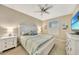 Cozy bedroom with a large window providing plenty of natural light and a ceiling fan for added comfort at 14271 Heritage Landing Blvd # 1516, Punta Gorda, FL 33955