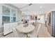 Open-concept dining space with table, seating, and seamless flow to the kitchen and living areas at 14271 Heritage Landing Blvd # 1516, Punta Gorda, FL 33955