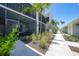 Screened in patios line the walking path with new greenery for each condo at 14271 Heritage Landing Blvd # 1516, Punta Gorda, FL 33955