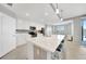Bright, modern kitchen featuring white cabinets, stainless steel appliances, and a large center island with seating at 14271 Heritage Landing Blvd # 1516, Punta Gorda, FL 33955