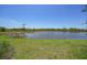 A beautiful view of the lake with clear blue skies at 14271 Heritage Landing Blvd # 1516, Punta Gorda, FL 33955