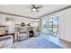 Open-concept living space flows from kitchen to comfortable living room with lake views at 14271 Heritage Landing Blvd # 1516, Punta Gorda, FL 33955