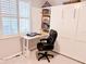 Office nook featuring built-in desk and storage around a large window with plantation shutters at 14271 Heritage Landing Blvd # 1516, Punta Gorda, FL 33955