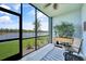 Relaxing screened porch with water view, plants, and seating for outdoor enjoyment at 14271 Heritage Landing Blvd # 1516, Punta Gorda, FL 33955