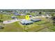 An aerial view of the home and neighborhood featuring a fenced-in backyard and spacious lots at 16098 Overdale Ct, Punta Gorda, FL 33955