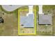 Aerial view of the home shows a well-maintained lot, roof, and proximity to neighboring properties at 16098 Overdale Ct, Punta Gorda, FL 33955
