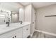 Bathroom featuring double sink vanity, black hardware, and walk-in shower with updated fixtures at 16098 Overdale Ct, Punta Gorda, FL 33955