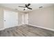 Bedroom features gray flooring, closet and ceiling fan for comfortable and convenient living at 16098 Overdale Ct, Punta Gorda, FL 33955