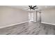 Spacious bedroom featuring gray flooring and a modern ceiling fan for comfortable living at 16098 Overdale Ct, Punta Gorda, FL 33955