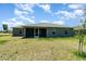 The rear exterior showcases a covered patio, complementing the home's design at 16098 Overdale Ct, Punta Gorda, FL 33955