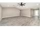 Bright living room with gray flooring, high ceilings, and neutral wall paint at 16098 Overdale Ct, Punta Gorda, FL 33955