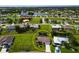 Aerial view of a single-Gathering home showing the house and surrounding landscaping in a lush community at 1612 Blue Lake Cir, Punta Gorda, FL 33983