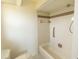 Bathroom featuring standard toilet, combination bath shower, grab bar, and tile surround at 1612 Blue Lake Cir, Punta Gorda, FL 33983
